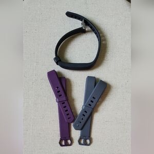 Fitbit Watch with Black, Purple, and Gray Bands
